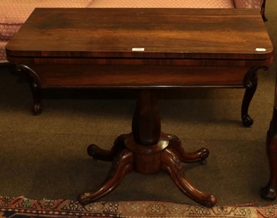 Lot 1164 - An early Victorian rosewood fold-over card table with octagonal baluster centre pedestal on...