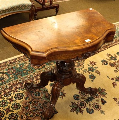 Lot 1168 - A Victorian walnut veneered card table, 91cm by 45cm by 74cm