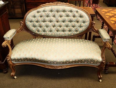 Lot 1169 - A Victorian carved walnut parlour sofa in the French taste with duck egg blue floral...