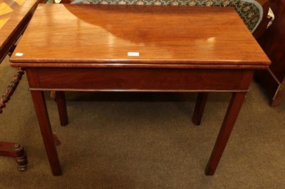 Lot 1176 - A George III mahogany fold-over tea table raised on plain square supports, 91cm by 44cm 76cm