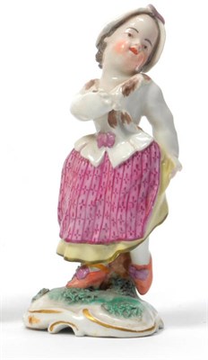 Lot 142 - A Frankenthal Porcelain Figure of a Girl, 1783, standing wearing a white cap and jacket lifting her