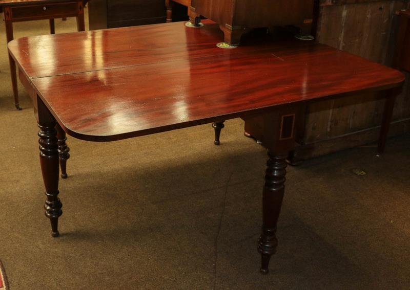 Lot 1189 - A large Victorian mahogany fold-over tea table raised on turned supports, 136cm by 114cm (open)...