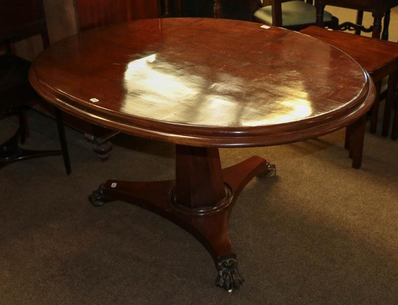 Lot 1192 - A Victorian mahogany centre pedestal snap-top supper table on a tri-form base with carved paw feet