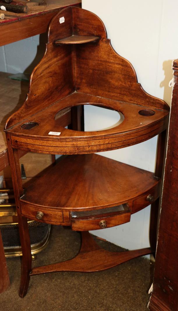 Lot 1200 - A George III mahogany bow-front corner washstand, with single drawer, on square outswept...