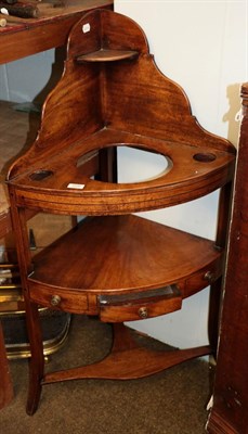 Lot 1200 - A George III mahogany bow-front corner washstand, with single drawer, on square outswept...