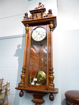 Lot 1201 - A Vienna type yew wood veneered twin weight driven striking wall clock circa. 1890, 134cm