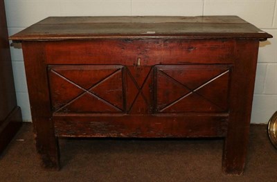 Lot 1204 - An 18th century French oak plank top coffer with carved panel front, 122cm by 60cm by 78cm
