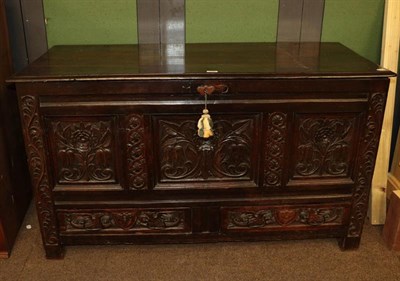 Lot 1208 - A 17th century carved and panelled mule chest monogrammed MD, 140cm by 58cm by 80cm