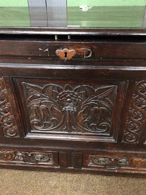 Lot 1208 - A 17th century carved and panelled mule chest monogrammed MD, 140cm by 58cm by 80cm