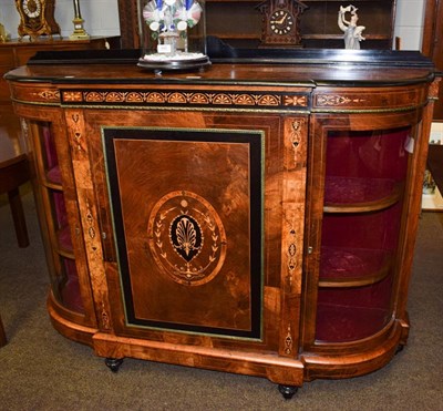 Lot 1213 - A Victorian figured walnut credenza inlaid and with ebonised mouldings and gilt metal mounts, 148cm