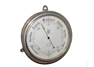 Lot 1216 - A silvered brass case aneroid barometer, 10'' silvered dial signed E & E. Emanuel, 3 The Hard,...