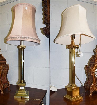 Lot 1224 - Two similar brass based table lamps of ionic column form, 60cm to th fittings