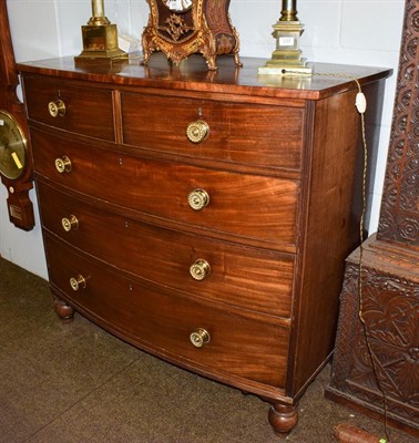 Lot 1225 - A 19th century mahogany bow-fronted four-height chest of drawers with brass handles and turned...