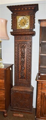 Lot 1226 - A carved oak thirty hour longcase clock, 11'' square brass dial, unsigned, 229cm high