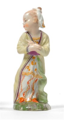 Lot 146 - A German Porcelain Figure of a Chinese Girl, late 18th century, standing wearing a headscarf...