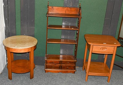 Lot 1237 - An Ercol blonde oak lamp table, a Goodwill furmica top table and a mahogany fret carved open...