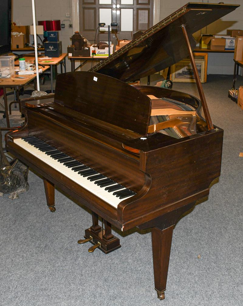 Lot 1248 - An early 20th century mahogany cased boudoir baby grand piano makers Challen, London raised on...