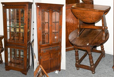 Lot 1258 - An old charm glazed corner cupboard, another old charm display cabinet, together with two oak...