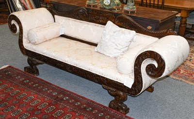 Lot 1285 - A modern carved mahogany scroll arm sofa in William IV style gadrooned, with foliate scrolls...