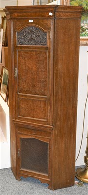 Lot 1288 - An early 20th century panelled oak floor standing corner cupboard 85cm by 62cm by 183cm
