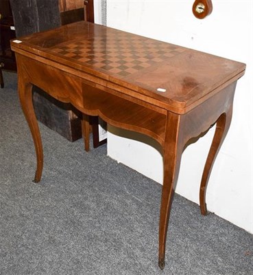 Lot 1294 - A 19th century inlaid fold-over tea table, the rectangular top with checkered games board, 85cm...