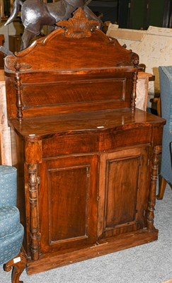 Lot 1297 - An early 20th century mahogany chiffonier of serpentine form, with turned supports, 87cm by 40cm by