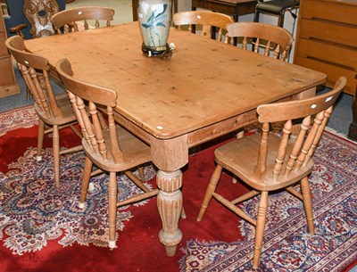 Lot 1300 - A modern pine farmhouse dining table, 183cm by 122cm by 77cm and six similar chairs (7)