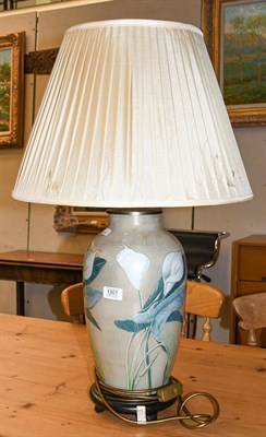 Lot 1301 - A large reverse decorated glass table lamp, gold ground and with flowers, 47cm to fitting