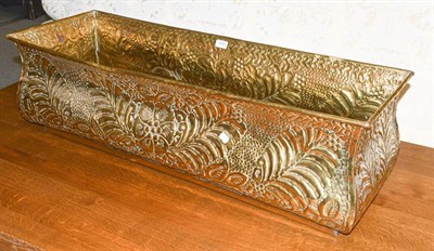 Lot 1303 - An early 20th century floral embossed brass plant trough, 104cm by 36cm by 31cm