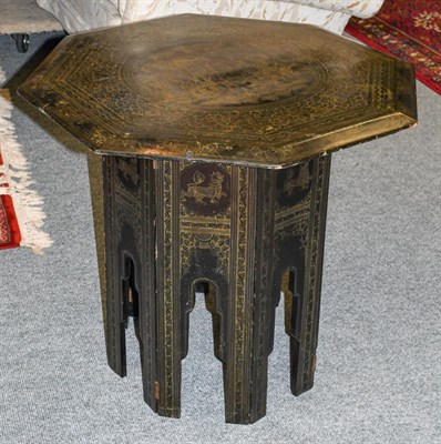 Lot 1304 - A 19th century Indian lacquered octagonal occasional table, incised to the top with Hindi...