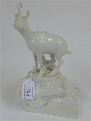 Lot 155 - A Volkstedt Porcelain Figure of a Goat, probably 19th century, standing on a rocky outcrop, on...