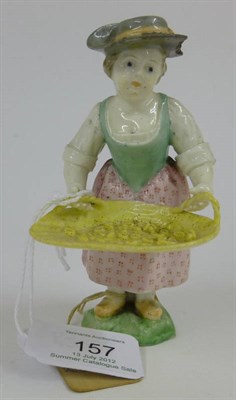 Lot 157 - A French Porcelain Figure of a Girl, probably 19th century, standing wearing a grey hat, green...