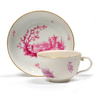 Lot 159 - A Ludwigsburg Porcelain Teacup and Saucer, circa 1765, with loop handle, painted in puce monochrome