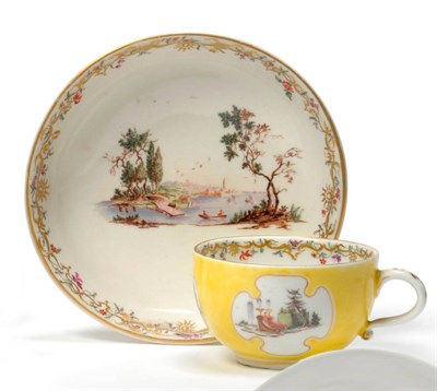 Lot 161 - A Nymphenburg Porcelain Yellow Ground Teacup and Saucer, circa 1760, painted with extensive...