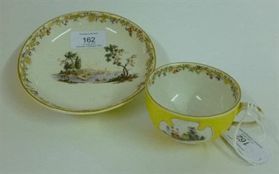 Lot 162 - A Nymphenburg Porcelain Yellow Ground Teacup and Saucer, circa 1760, en suite to the previous...