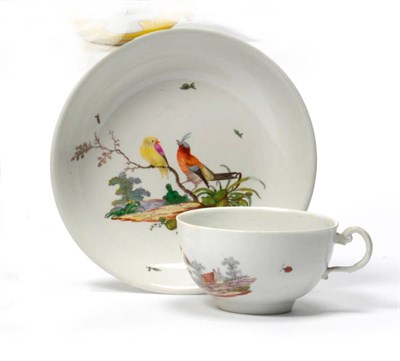 Lot 168 - An Ansbach Porcelain Teacup and Saucer, circa 1780, with scroll handle, painted in colours with...