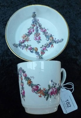 Lot 182 - A Höchst Porcelain Coffee Can and Saucer, circa 1775, with snake handle, painted with swags of...