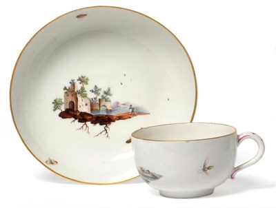 Lot 183 - A Höchst Teacup and Saucer, circa 1765, painted with landscape vignettes of figures and...