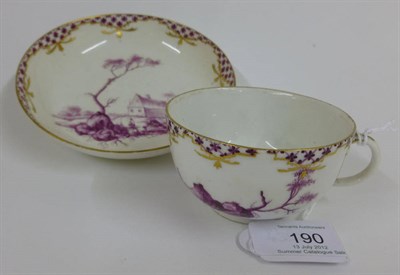Lot 190 - An Academic Period Meissen Porcelain Teacup and Saucer, circa 1765, painted in puce monochrome with