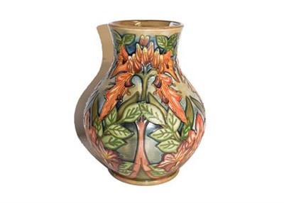 Lot 180 - A modern Moorcroft flame of the forest design vase by Philip Gibson, impressed and painted...