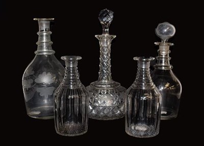 Lot 244 - Five various glass decanters, including a pair of small Georgian examples (lacking stoppers)