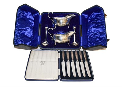 Lot 250 - ~A pair of cased silver sauce boats and ladles together with cased silver teaspoons, each...