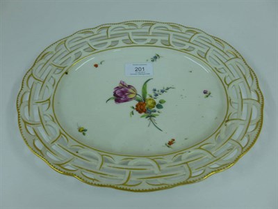 Lot 201 - An Amstel Porcelain Oval Dish, circa 1790, painted in colours  with a spray of flowers and...