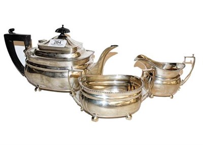 Lot 264 - A three-piece silver tea service, engraved with an inscription, 892gr