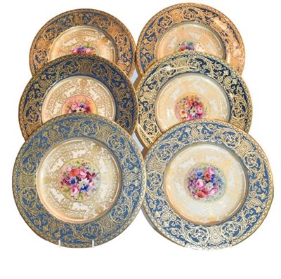 Lot 269 - Royal Worcester cabinet plates with blue borders, profuse gilt decoration and central floral panels