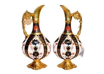 Lot 275 - A pair of Royal Crown Derby ewers in the Imari pattern 1128, 25cm (2)