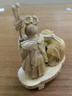 Lot 284 - A 19th century Japanese Ivory Okimono, depicting a man and a lady collecting a turtle, 13.5cm high