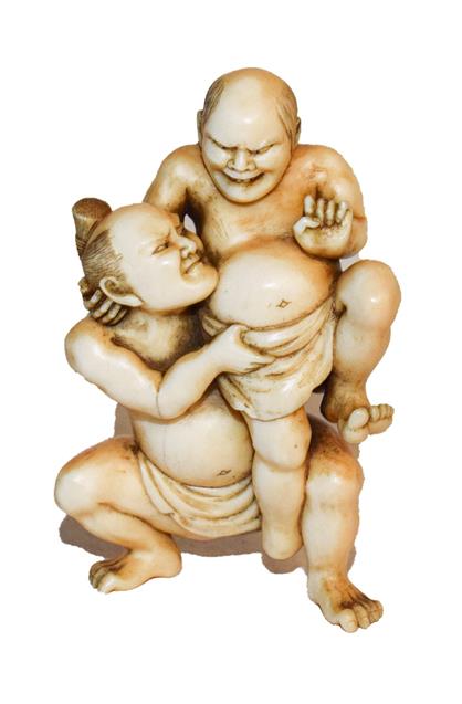 Lot 286 - A 19th century Japanese Ivory Okimono, depicting two sumo wrestlers, 5.5cm high