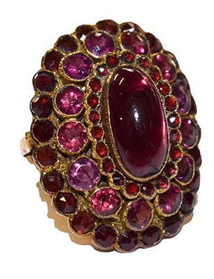 Lot 310 - A garnet cluster ring, stamped '18CT', finger size L