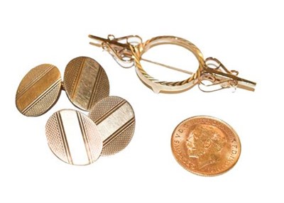 Lot 311 - A pair of 9 carat gold cufflinks and a half sovereign brooch, dated 1913